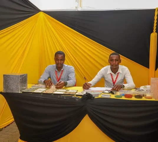 Fairdeal Terrazzo team members presenting terrazzo material samples at an industry expo booth