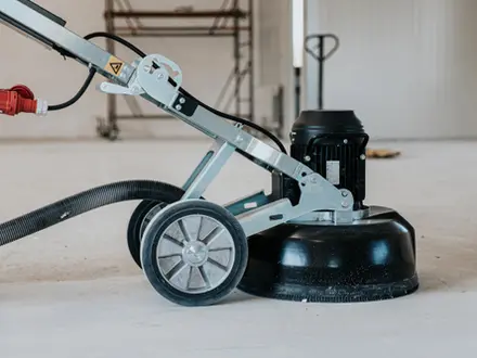 a floor grinding and polishing machine on a concrete surface